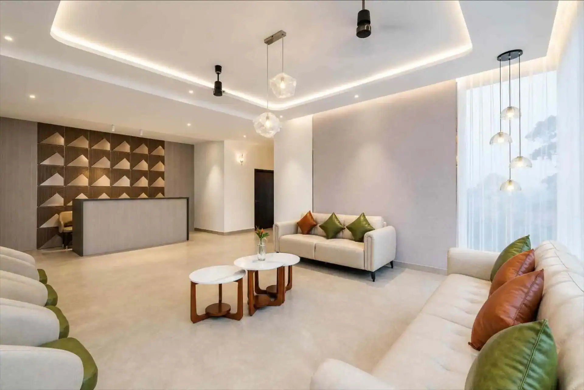 Vega Munnar reception area with pendant lights and contemporary lobby