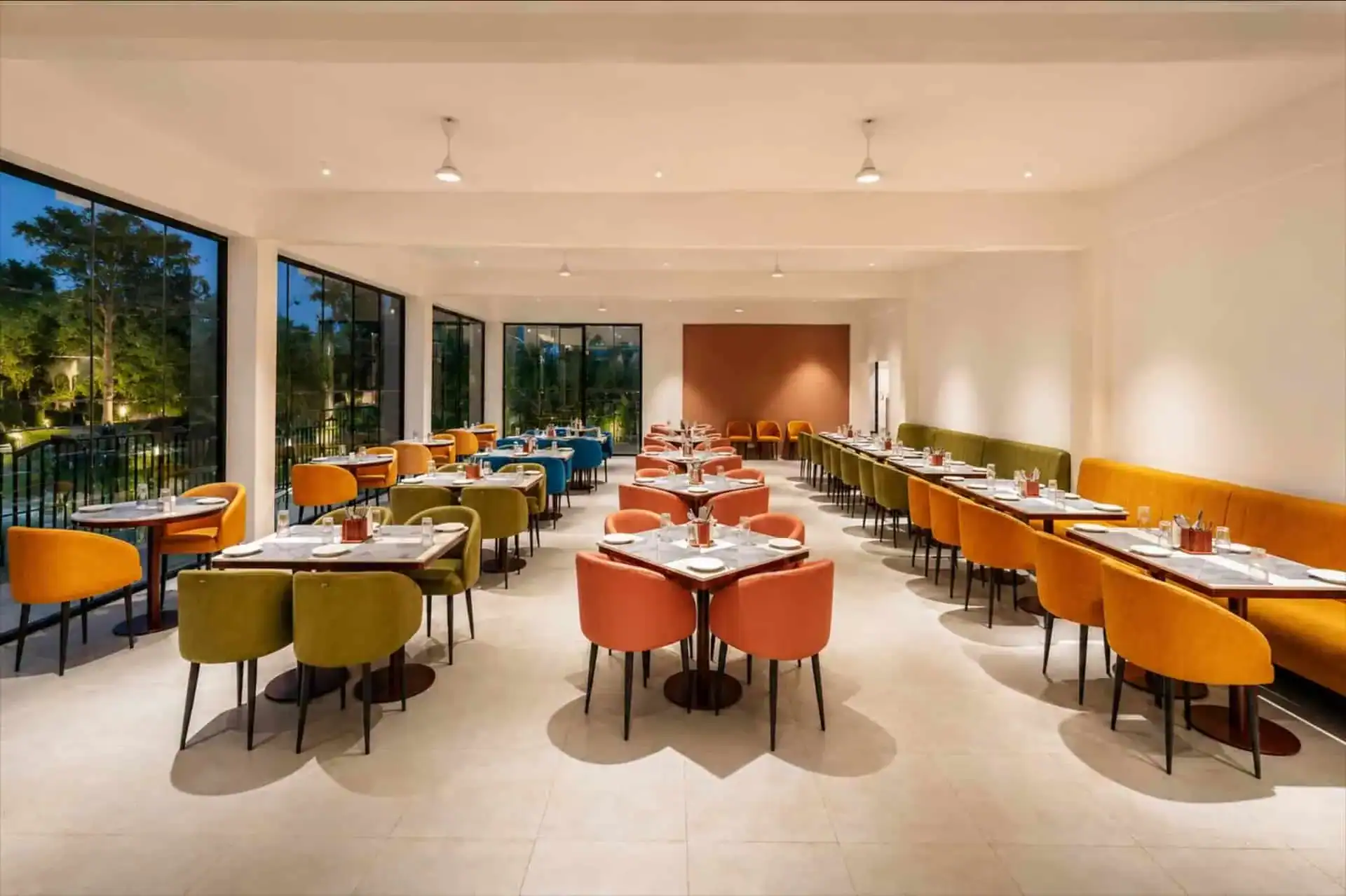 Dining room with mustard yellow banquette and full perspective view