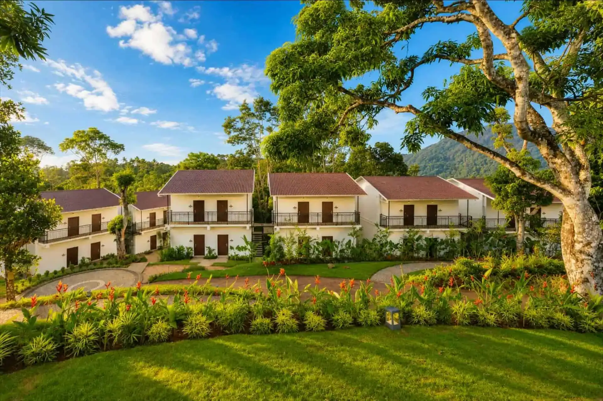 Elevated view of cottage complex courtyard with mountain backdrop