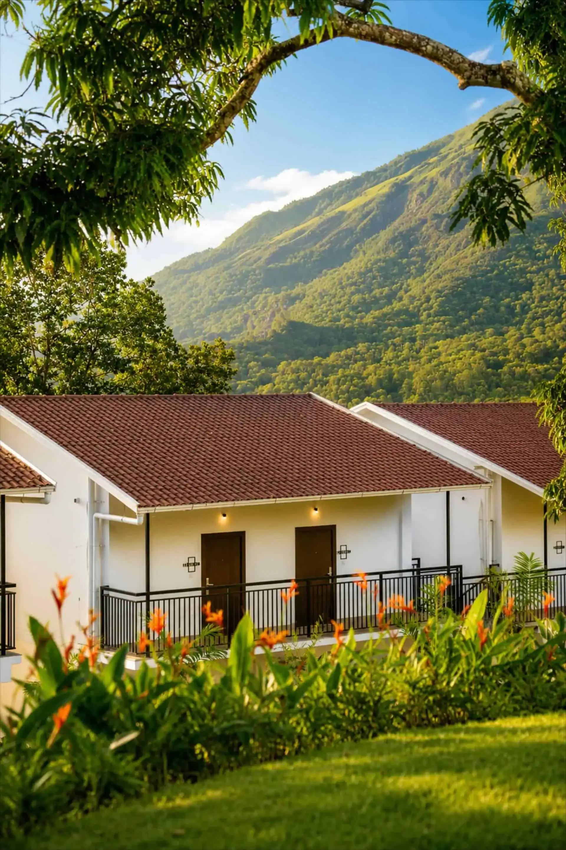 Cottage with terracotta roof, heliconia garden, and mountain peak