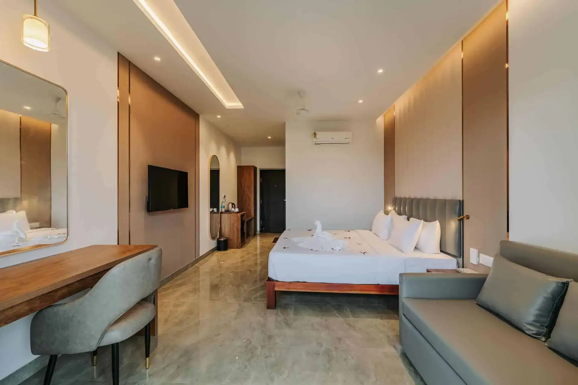 Wide room shot showing full layout with marble floor and all furnishings