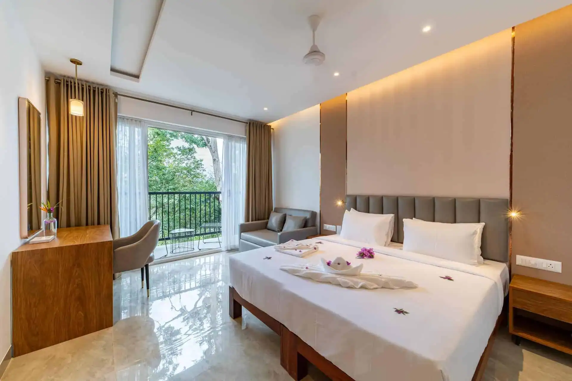Full Vega Bliss Cottage layout showing bed, dressing table, sofa, and balcony