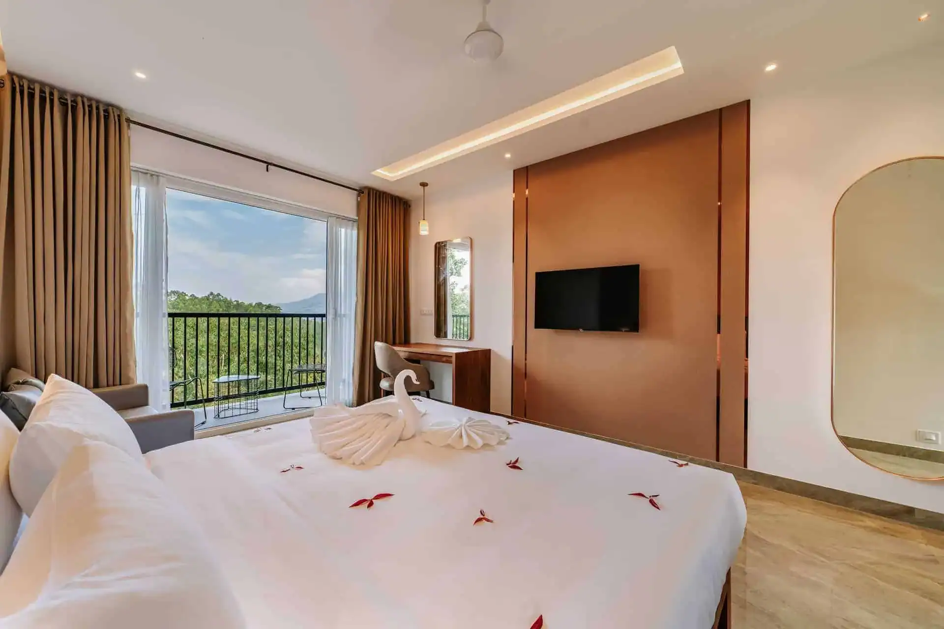 Vega Bliss Cottage king bed with rose petal decoration and open valley-view balcony